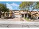 Charming two-story home with a well-kept lawn, a two car garage and brick driveway at 1163 Highbury Grove St, Henderson, NV 89002