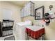 Convenient laundry room with washer, sink, and storage shelves at 1163 Highbury Grove St, Henderson, NV 89002