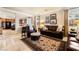 Cozy living room with leather furniture, patterned rug, and view to the kitchen at 1163 Highbury Grove St, Henderson, NV 89002