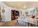 View of bedroom featuring entertainment center, closet, sitting area, and elegant decor at 1163 Highbury Grove St, Henderson, NV 89002