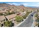 A street view showcases homes and the neighborhood featuring desert landscaping and tile roofs at 1163 Highbury Grove St, Henderson, NV 89002