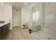 Bathroom featuring a soaking tub, glass shower, dual vanities and modern fixtures at 11895 Skyline Arch Ct, Las Vegas, NV 89138