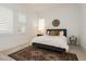 Cozy bedroom featuring two windows with modern shutters and a decorative wall hanging at 11895 Skyline Arch Ct, Las Vegas, NV 89138