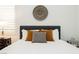 Bedroom close-up featuring throw pillows, linens, and a decorative wall hanging at 11895 Skyline Arch Ct, Las Vegas, NV 89138