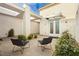 Outdoor courtyard featuring modern furniture, a covered patio, and stylish design at 11895 Skyline Arch Ct, Las Vegas, NV 89138