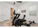 Home exercise room with plenty of natural light and access to a full bathroom at 11895 Skyline Arch Ct, Las Vegas, NV 89138