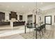 Open-concept kitchen and dining area with stainless steel appliances and modern finishes at 11895 Skyline Arch Ct, Las Vegas, NV 89138