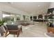 Open-concept living space with a view of the kitchen and backyard pool at 11895 Skyline Arch Ct, Las Vegas, NV 89138