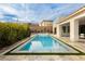 Stunning backyard pool surrounded by lush greenery, offering a private and tranquil outdoor retreat for relaxation and recreation at 11895 Skyline Arch Ct, Las Vegas, NV 89138