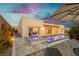 Backyard with a sparkling pool, spa, covered patio and lounge area at 11895 Skyline Arch Ct, Las Vegas, NV 89138