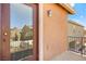 Balcony view with railing, exterior light, and exterior house texture at 1220 Earth Ct, North Las Vegas, NV 89032