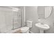 Bathroom features glass shower doors, white porcelain toilet and sink at 1220 Earth Ct, North Las Vegas, NV 89032