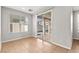 Light bedroom with sliding door to back patio and neutral tile flooring at 1220 Earth Ct, North Las Vegas, NV 89032