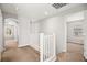 Upstairs hallway featuring neutral carpet and views to bedrooms at 1220 Earth Ct, North Las Vegas, NV 89032