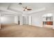 Large main bedroom with tray ceiling, ceiling fan and neutral carpet at 1220 Earth Ct, North Las Vegas, NV 89032