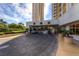 Luxury condo entrance featuring porte cochere with valet parking and meticulously manicured landscaping at 135 E Harmon Ave # 2601&2603, Las Vegas, NV 89109