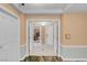 Elegant entrance foyer with double doors to living areas, tile flooring, and muted wall tones at 135 E Harmon Ave # 2601&2603, Las Vegas, NV 89109