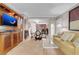 Inviting living room featuring a TV, a dining table with chairs, a sofa, and a glimpse of the kitchen area at 135 E Harmon Ave # 2601&2603, Las Vegas, NV 89109