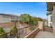 Balcony view showcasing lush landscaping and mature trees, enhanced by iron railings and a clear blue sky at 1381 Robard St, Las Vegas, NV 89135