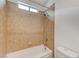 Bathroom with tiled walls, a shower/tub combo, and a toilet at 1381 Robard St, Las Vegas, NV 89135