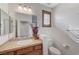 Bathroom featuring a single sink, granite countertops, and a framed mirror at 1381 Robard St, Las Vegas, NV 89135