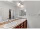 Bathroom features a double sink vanity and separate shower at 1381 Robard St, Las Vegas, NV 89135