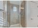 Bathroom interior showcasing a glass door shower and a door to the next room at 1381 Robard St, Las Vegas, NV 89135