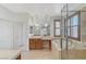 Bathroom with tiled flooring, double sink vanity, soaking tub, and a glass enclosed shower at 1381 Robard St, Las Vegas, NV 89135