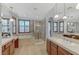 Bright bathroom featuring double vanities, a soaking tub, and a glass enclosed shower at 1381 Robard St, Las Vegas, NV 89135