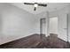 Bedroom with dark wood floors, closet and open entry to a bathroom at 1381 Robard St, Las Vegas, NV 89135