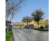 Community entrance gate with brick columns and mature landscaping, offering privacy and security at 1381 Robard St, Las Vegas, NV 89135