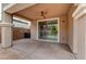 Covered patio featuring a ceiling fan and providing seamless access to the landscaped backyard through a sliding glass door at 1381 Robard St, Las Vegas, NV 89135