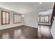 Dining area with hardwood floors, modern light fixture and windows with wood shutters allowing natural light at 1381 Robard St, Las Vegas, NV 89135