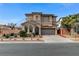 Stunning two-story home featuring stucco exterior, tile roof, arched windows, and a well-manicured front yard at 1381 Robard St, Las Vegas, NV 89135