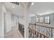 Upstairs hallway with decorative iron railing and archways at 1381 Robard St, Las Vegas, NV 89135