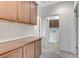 Hallway with storage cabinets leading into laundry room with washer and dryer hookups at 1381 Robard St, Las Vegas, NV 89135