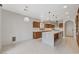 Bright kitchen with a marble island, stainless steel appliances, and wooden cabinets at 1381 Robard St, Las Vegas, NV 89135