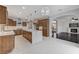 Modern kitchen featuring a large island, pendant lighting, stainless steel appliances, and wooden cabinets at 1381 Robard St, Las Vegas, NV 89135