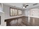 Bright living room with hardwood floors, fireplace, and large shuttered windows offering ample natural light at 1381 Robard St, Las Vegas, NV 89135