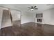 Inviting living room featuring a fireplace, hardwood floors, and staircase with wrought iron, for a cozy feel at 1381 Robard St, Las Vegas, NV 89135