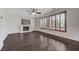 Inviting living room features a fireplace, dark hardwood floors, and shuttered windows at 1381 Robard St, Las Vegas, NV 89135