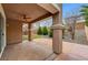 A covered patio with ceiling fan looks out onto a landscaped backyard at 1381 Robard St, Las Vegas, NV 89135