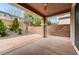 Covered patio with desert landscaping and block wall for privacy at 1381 Robard St, Las Vegas, NV 89135