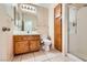 Bathroom features a vanity, toilet, and a glass shower enclosure with tile flooring at 1424 Desert Hills Dr, Las Vegas, NV 89117