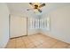 Bedroom featuring tile floors, closet and plantation shutters at 1424 Desert Hills Dr, Las Vegas, NV 89117