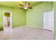 Spacious bedroom featuring tile floors and a ceiling fan at 1424 Desert Hills Dr, Las Vegas, NV 89117