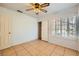 Bedroom with closet, door to hall and plantation shutters at 1424 Desert Hills Dr, Las Vegas, NV 89117