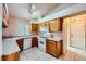 Eat-in kitchen features white appliances and tile floors at 1424 Desert Hills Dr, Las Vegas, NV 89117