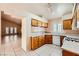 Kitchen view open to dining area and fireplace at 1424 Desert Hills Dr, Las Vegas, NV 89117