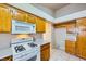 Cozy kitchen showcasing an oven, gas cooktop, microwave and ample storage space at 1424 Desert Hills Dr, Las Vegas, NV 89117